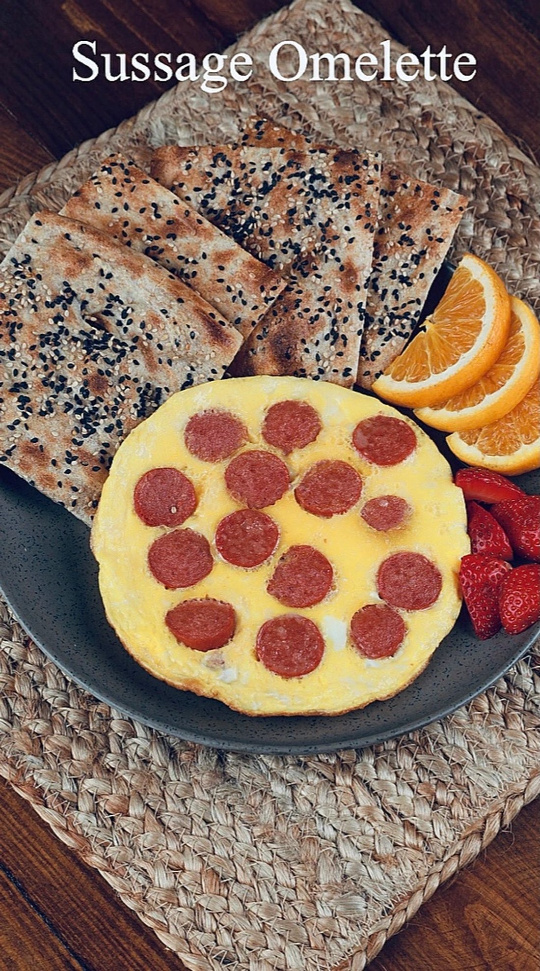 Sausage omelet with fresh sangak bread and orange slices